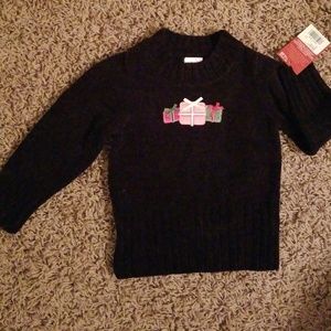 Black sweater with "presents"
